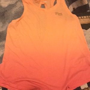 Pink and orange shirt, it’s a medium.